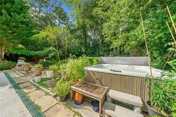 a backyard of a house with outdoor seating