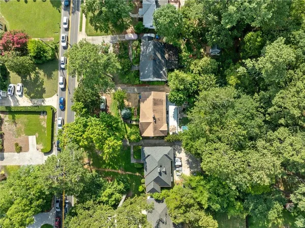 an aerial view of a houses with yard