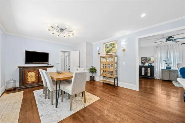 a view of a livingroom with furniture and a flat screen tv