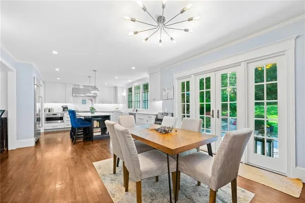 a view of a dining room with furniture window and wooden floor