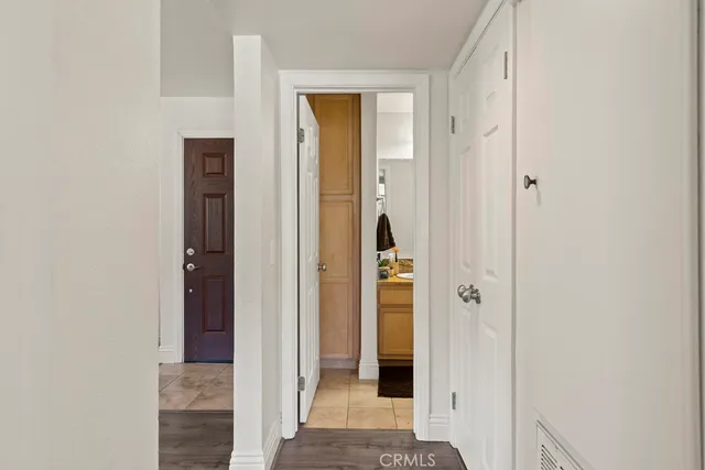 a view of a hallway with a wooden door