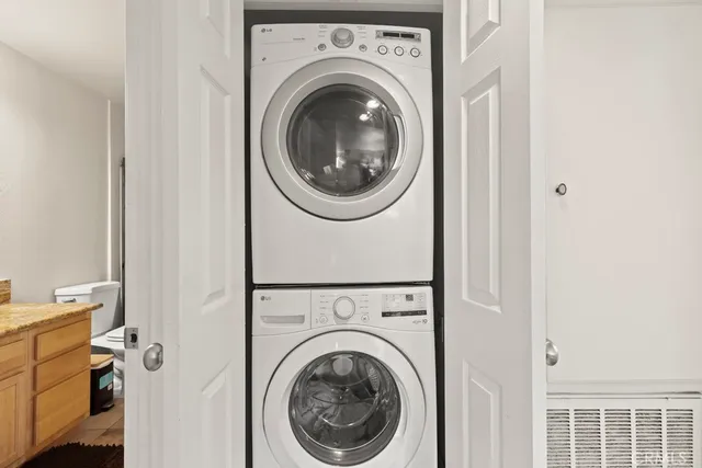a view of a hallway with washer and dryer