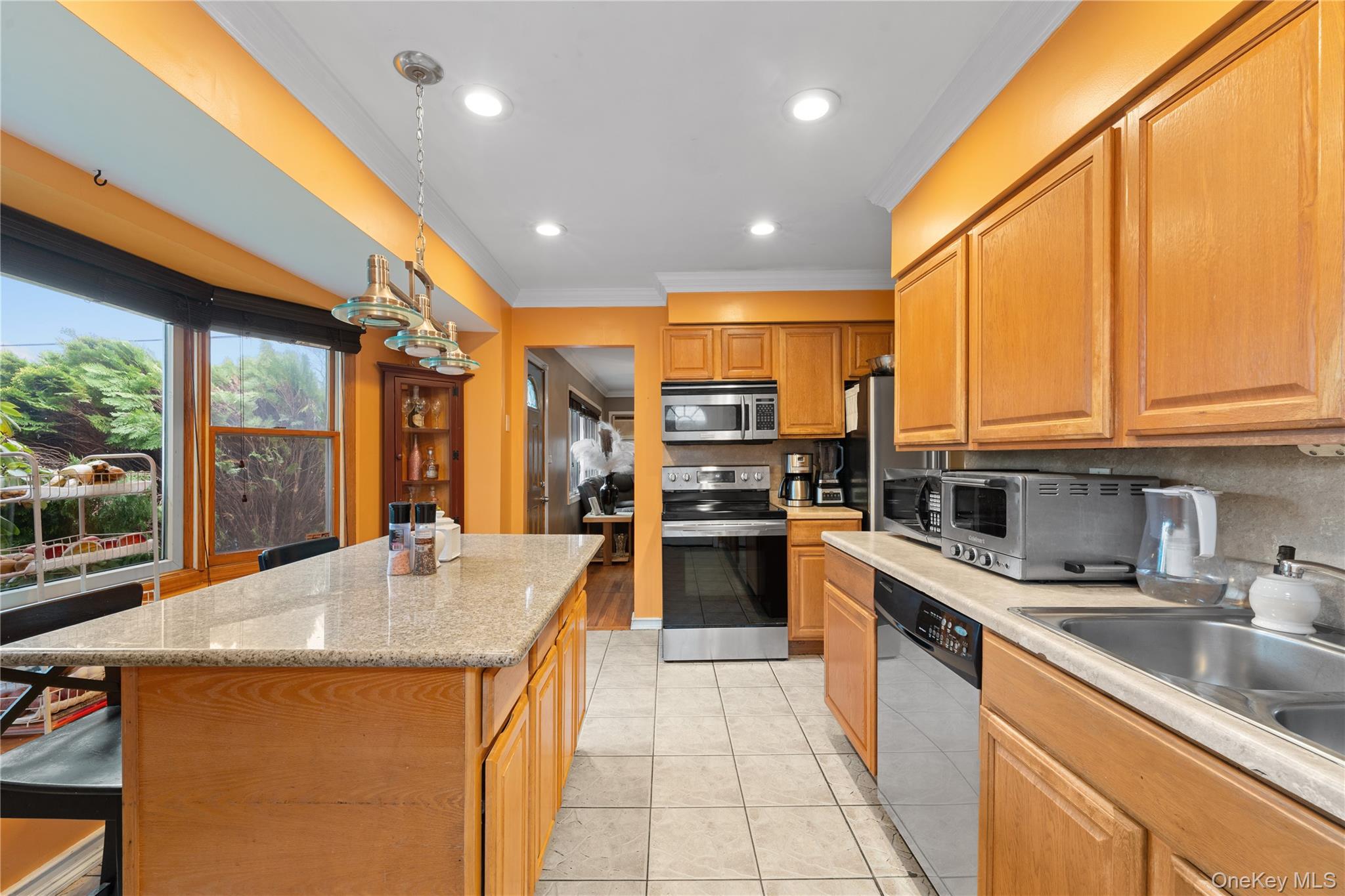 762 Buchanan Road East Meadow, NY 11554 - Photo 21 of 40 a kitchen with counter top space a sink and appliances