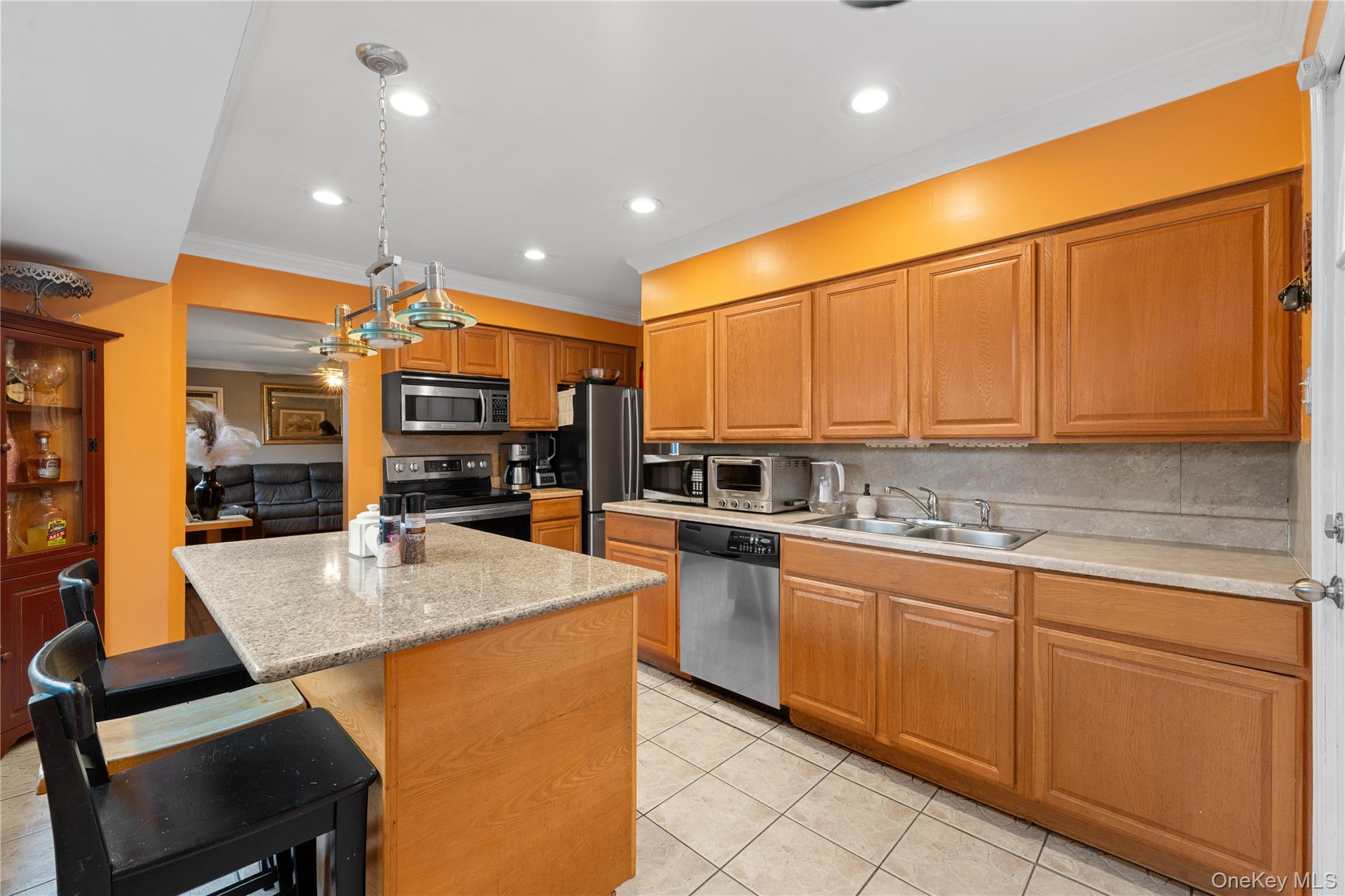 762 Buchanan Road East Meadow, NY 11554 - Photo 22 of 40 a large kitchen with stainless steel appliances granite countertop a sink and cabinets
