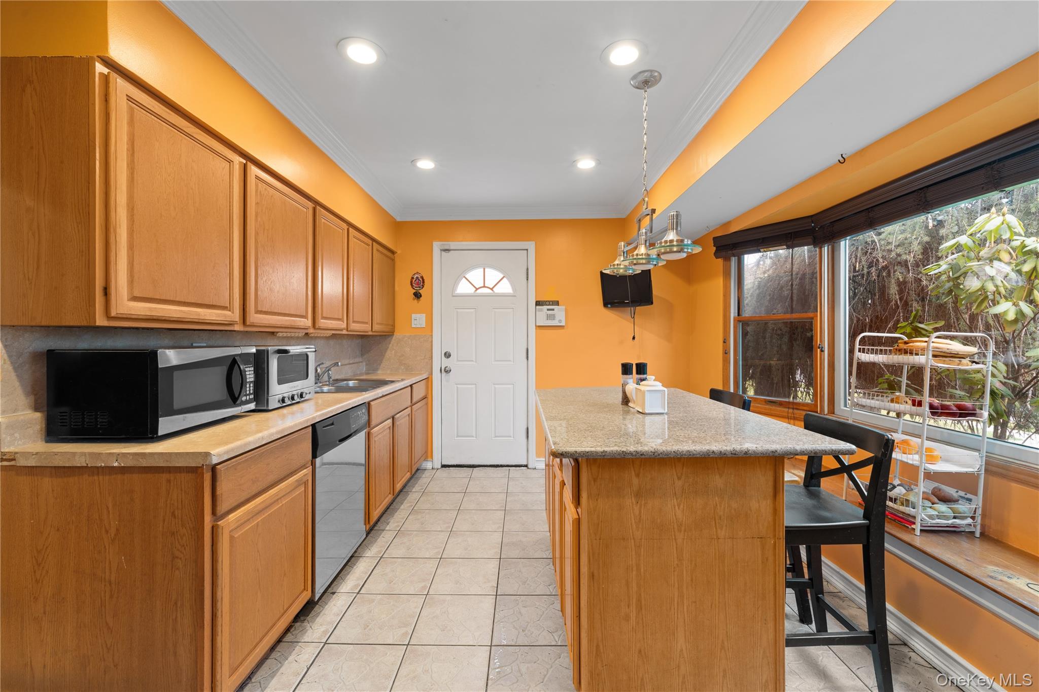 762 Buchanan Road East Meadow, NY 11554 - Photo 24 of 40 a kitchen with stainless steel appliances granite countertop a sink a stove and a refrigerator
