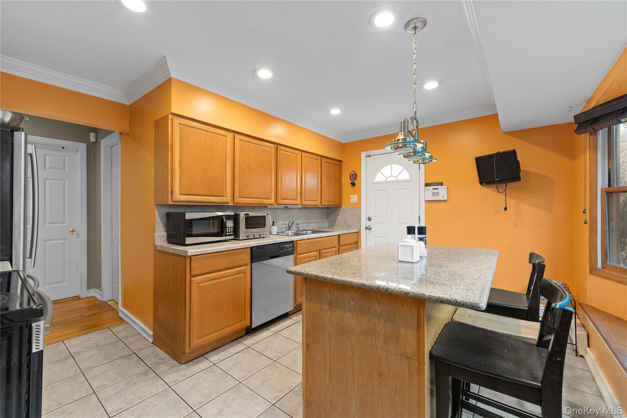 762 Buchanan Road East Meadow, NY 11554 - Photo 25 of 40 a kitchen with stainless steel appliances granite countertop a sink and a refrigerator