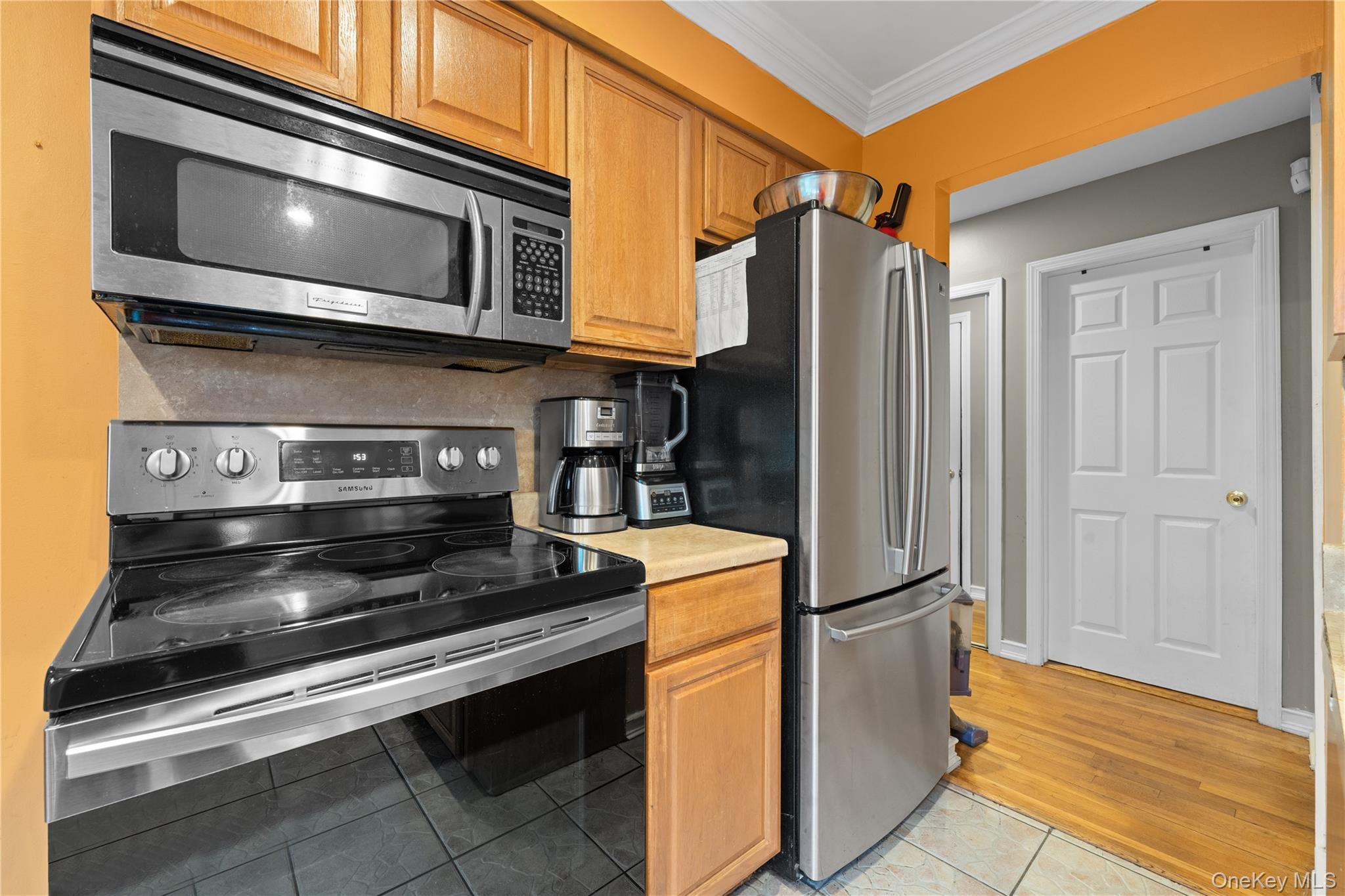 762 Buchanan Road East Meadow, NY 11554 - Photo 26 of 40 a kitchen with a stove and a microwave