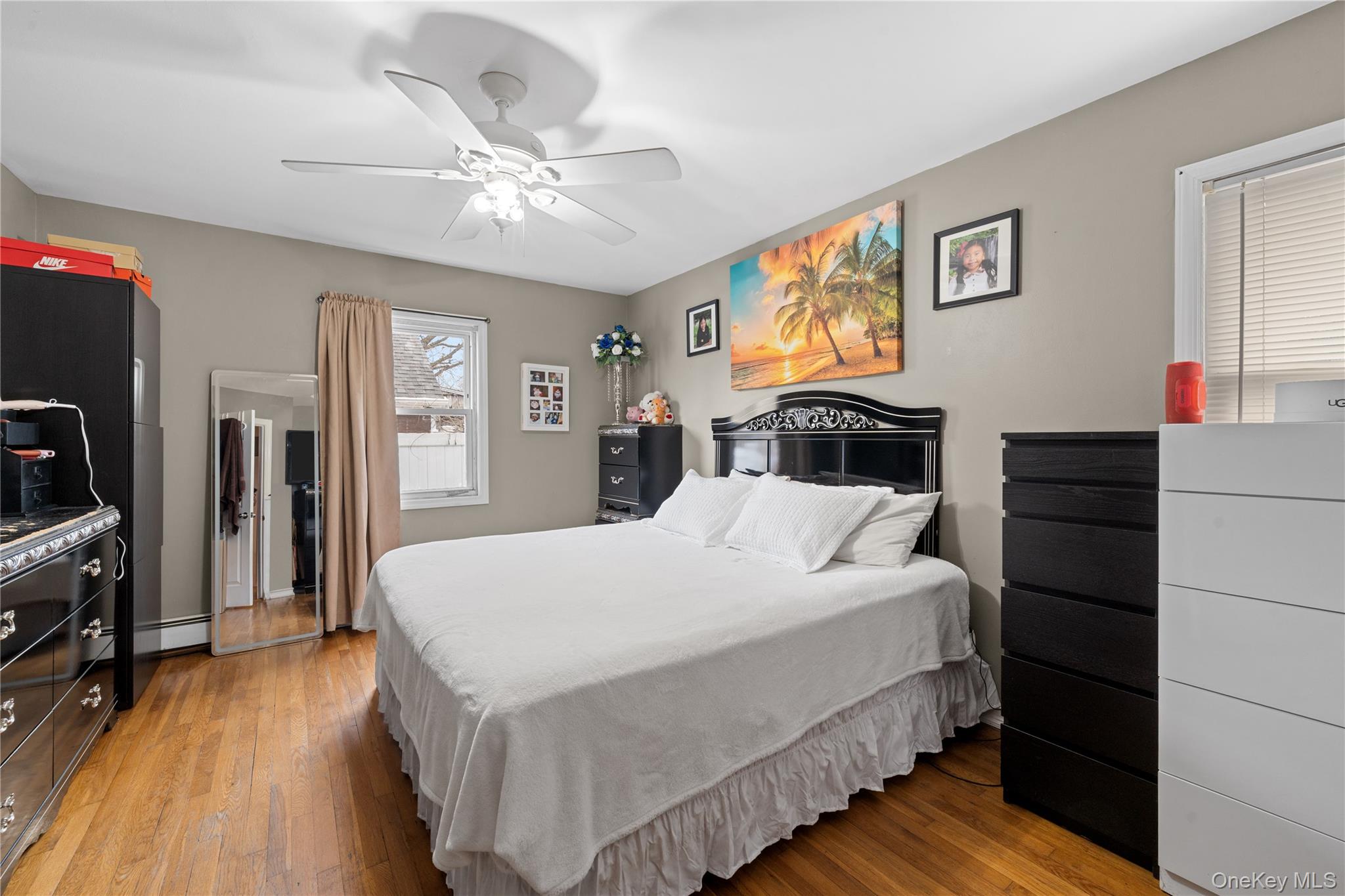 762 Buchanan Road East Meadow, NY 11554 - Photo 27 of 40 a bedroom with a bed and wooden floor