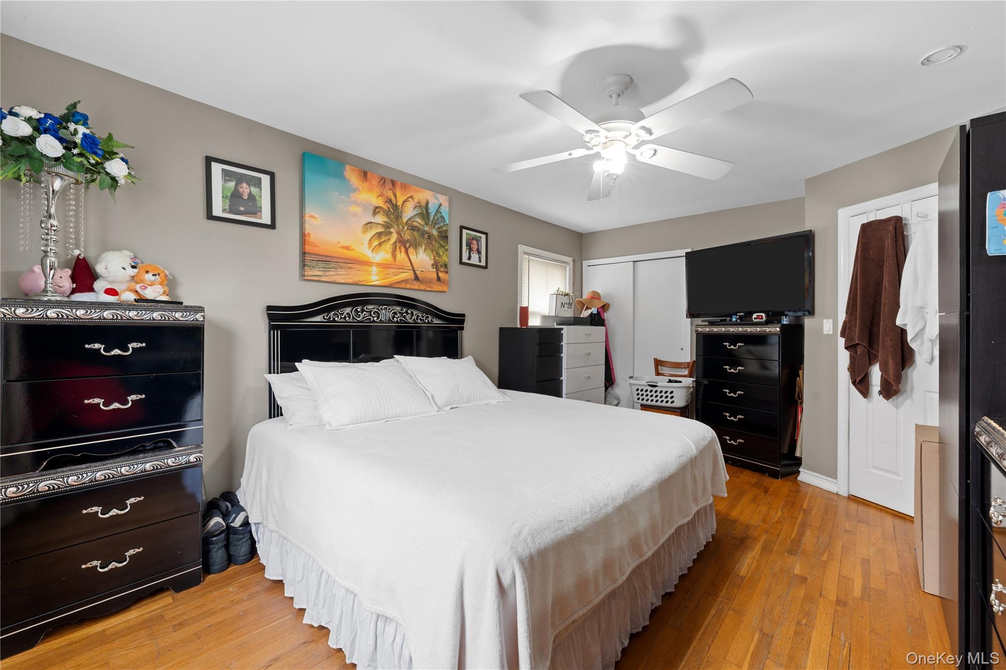 762 Buchanan Road East Meadow, NY 11554 - Photo 28 of 40 a bedroom with a bed and a chandelier