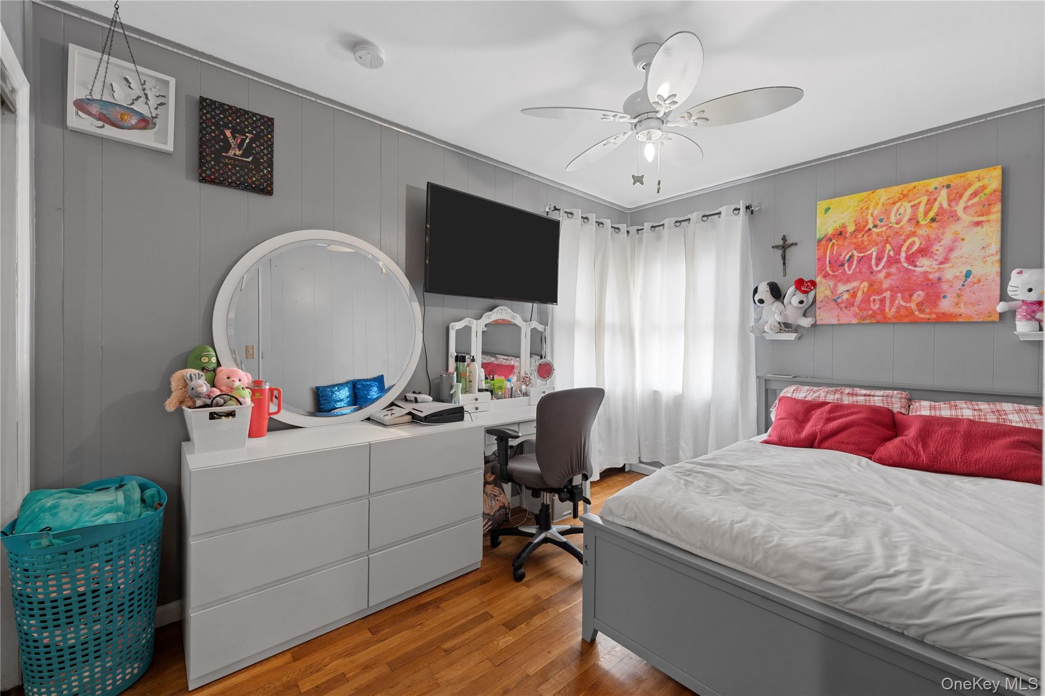 762 Buchanan Road East Meadow, NY 11554 - Photo 29 of 40 a bedroom with a bed and a chandelier