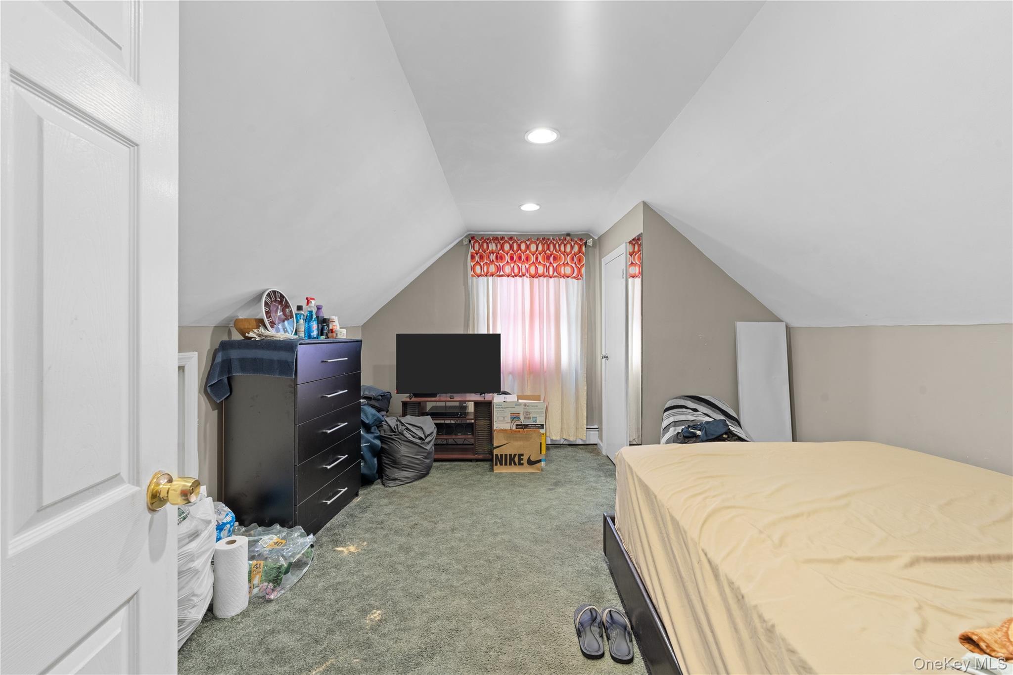 762 Buchanan Road East Meadow, NY 11554 - Photo 35 of 40 a bedroom with a bed and a flat screen tv