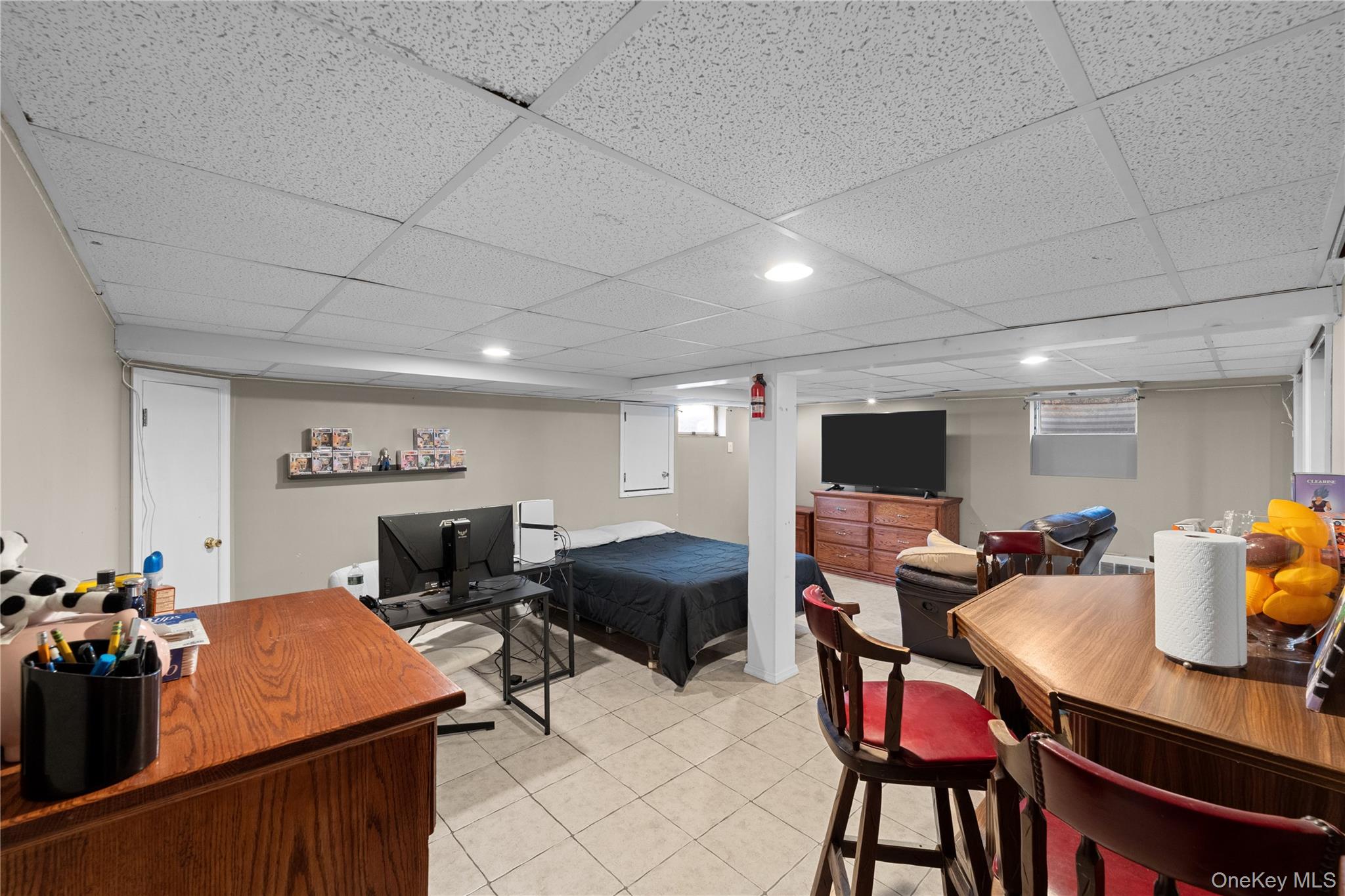 762 Buchanan Road East Meadow, NY 11554 - Photo 37 of 40 a room with furniture a flat screen tv and a dining table