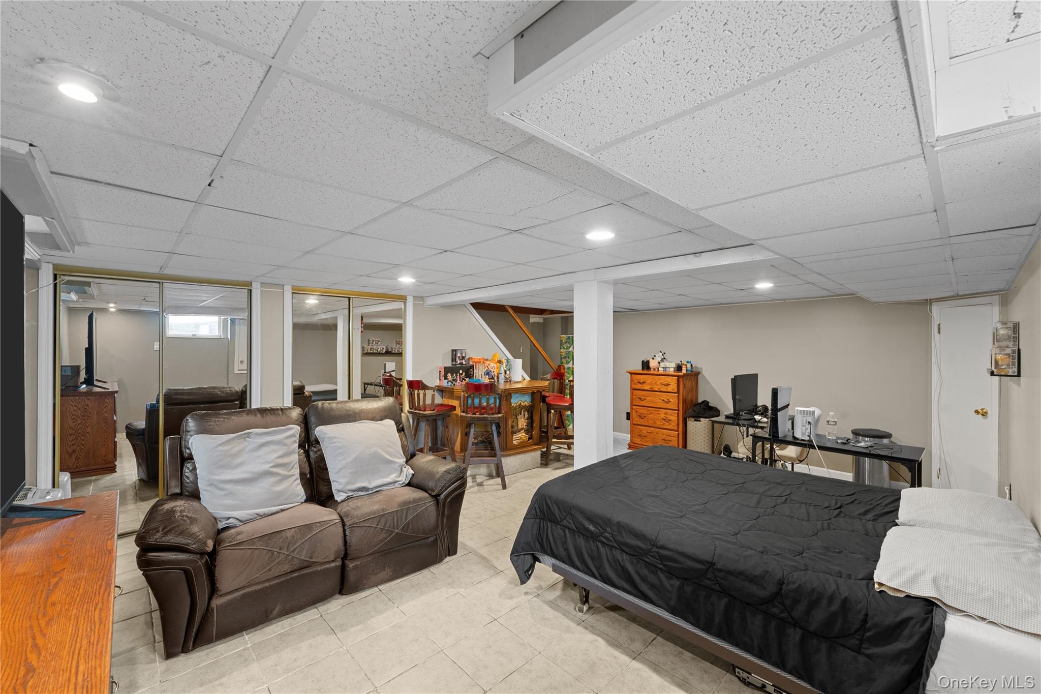 762 Buchanan Road East Meadow, NY 11554 - Photo 38 of 40 a living room with furniture a flat screen tv and a large window
