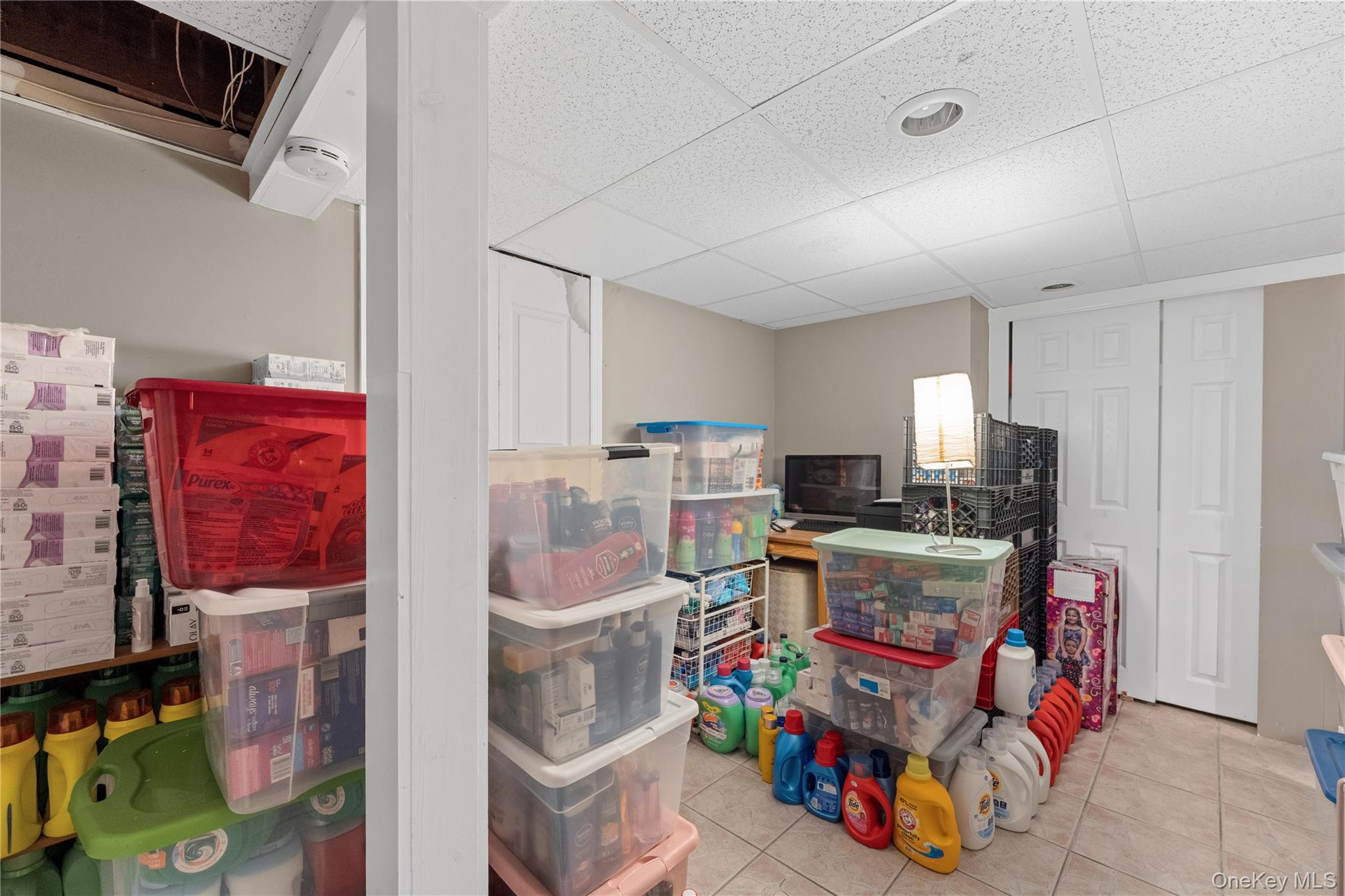 762 Buchanan Road East Meadow, NY 11554 - Photo 40 of 40 a room with furniture a flat screen tv and a refrigerator