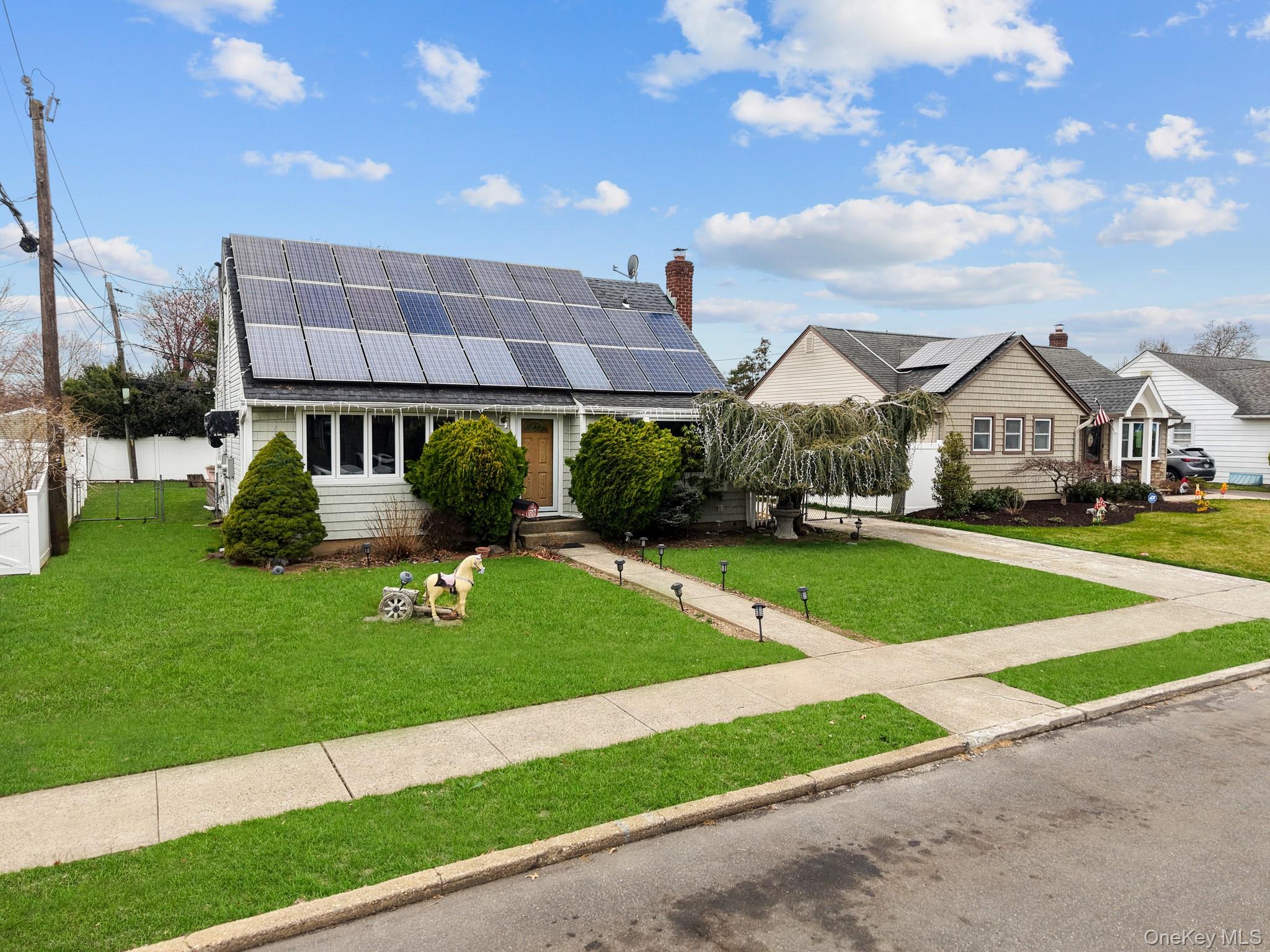 762 Buchanan Road East Meadow, NY 11554 - Photo 9 of 40 a front view of a house with a yard