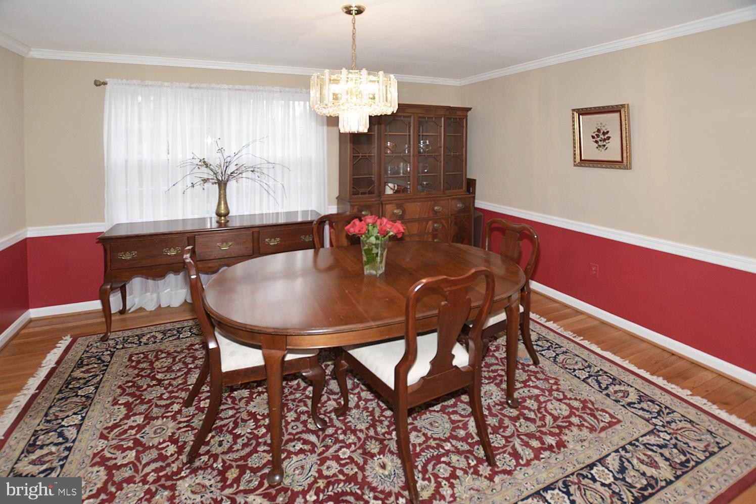 6906 Spur Road Springfield, VA 22153 - Photo 17 of 28 a view of a dining room with furniture and chandelier