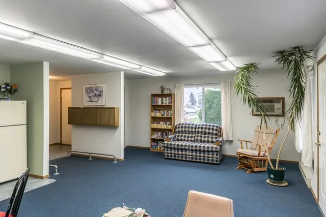 a bedroom with furniture and a window