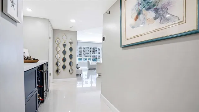 a white toilet sitting next to a white wall