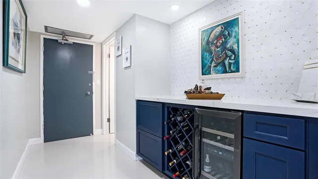 a bathroom with a sink vanity granite tub and shower