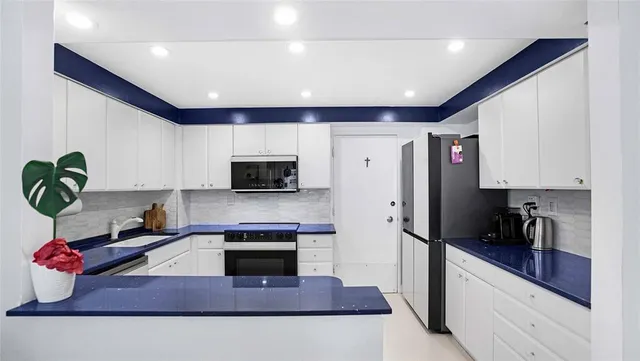a bathroom with a sink mirror and shower