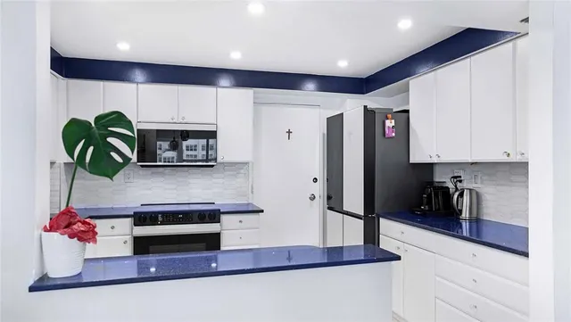 a white toilet sitting next to a bathroom sink