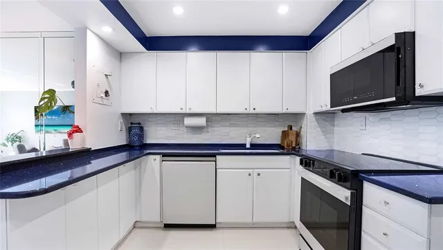 a living room with furniture and a book shelf