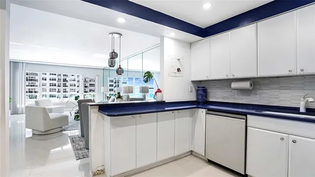 a living room with furniture and a book shelf