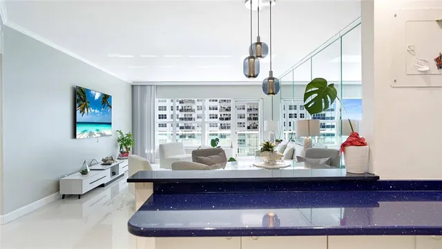 a view of swimming pool with a yard and palm trees