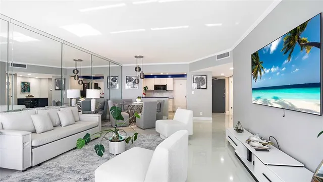 a living room with furniture and a floor to ceiling window