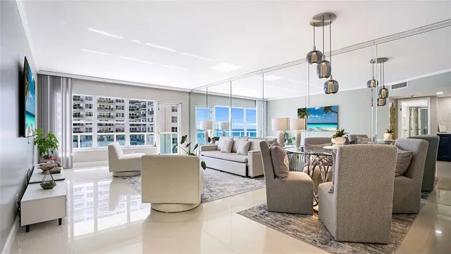 a hallway with painting on the wall and a dresser