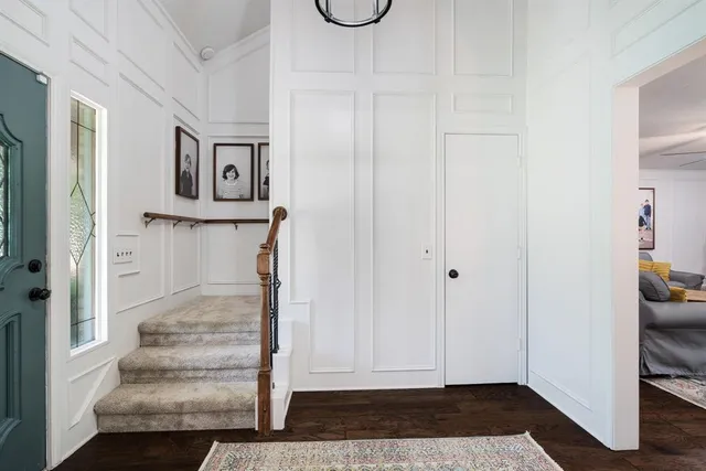 a view of an entryway with wooden floor