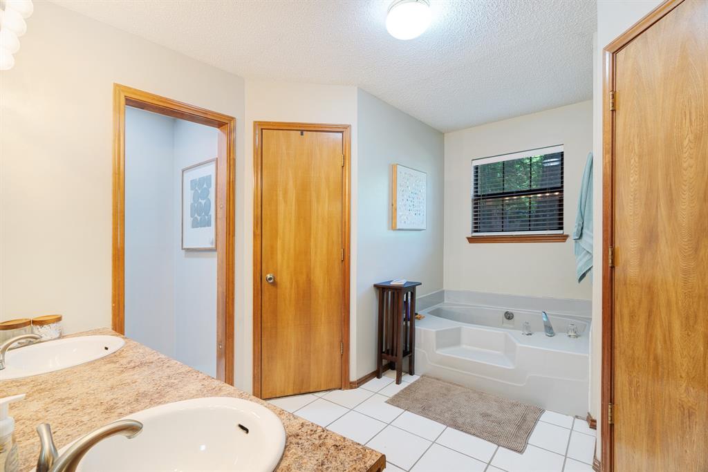 730 Cedar Creek Drive Reno, TX 75462 - Photo 14 of 28 a bedroom with a bed and a window