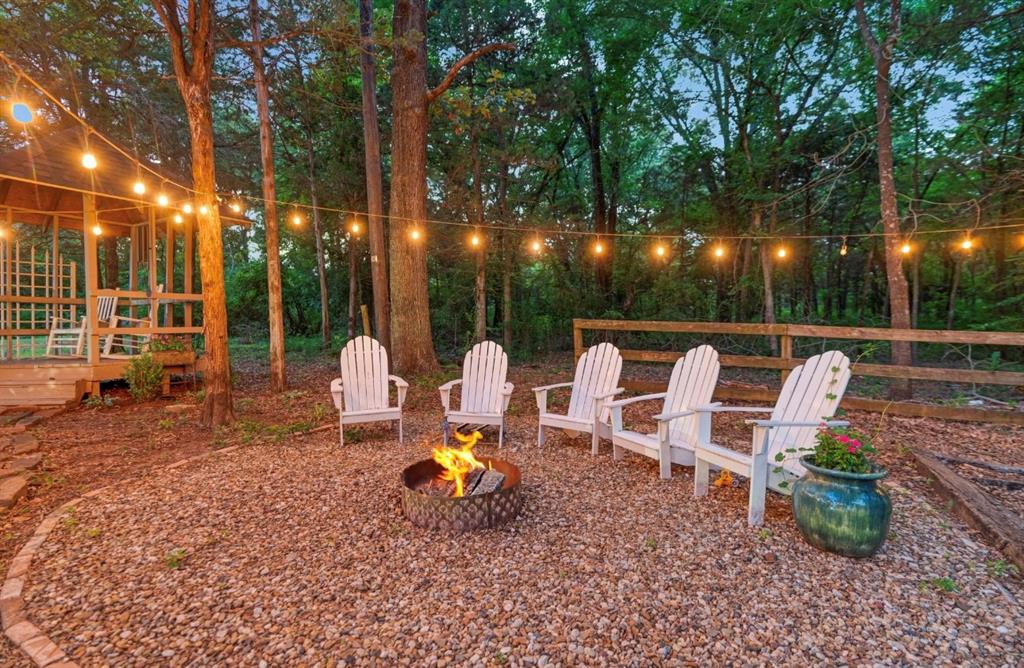 730 Cedar Creek Drive Reno, TX 75462 - Photo 28 of 28 a view of a chair and tables in the patio