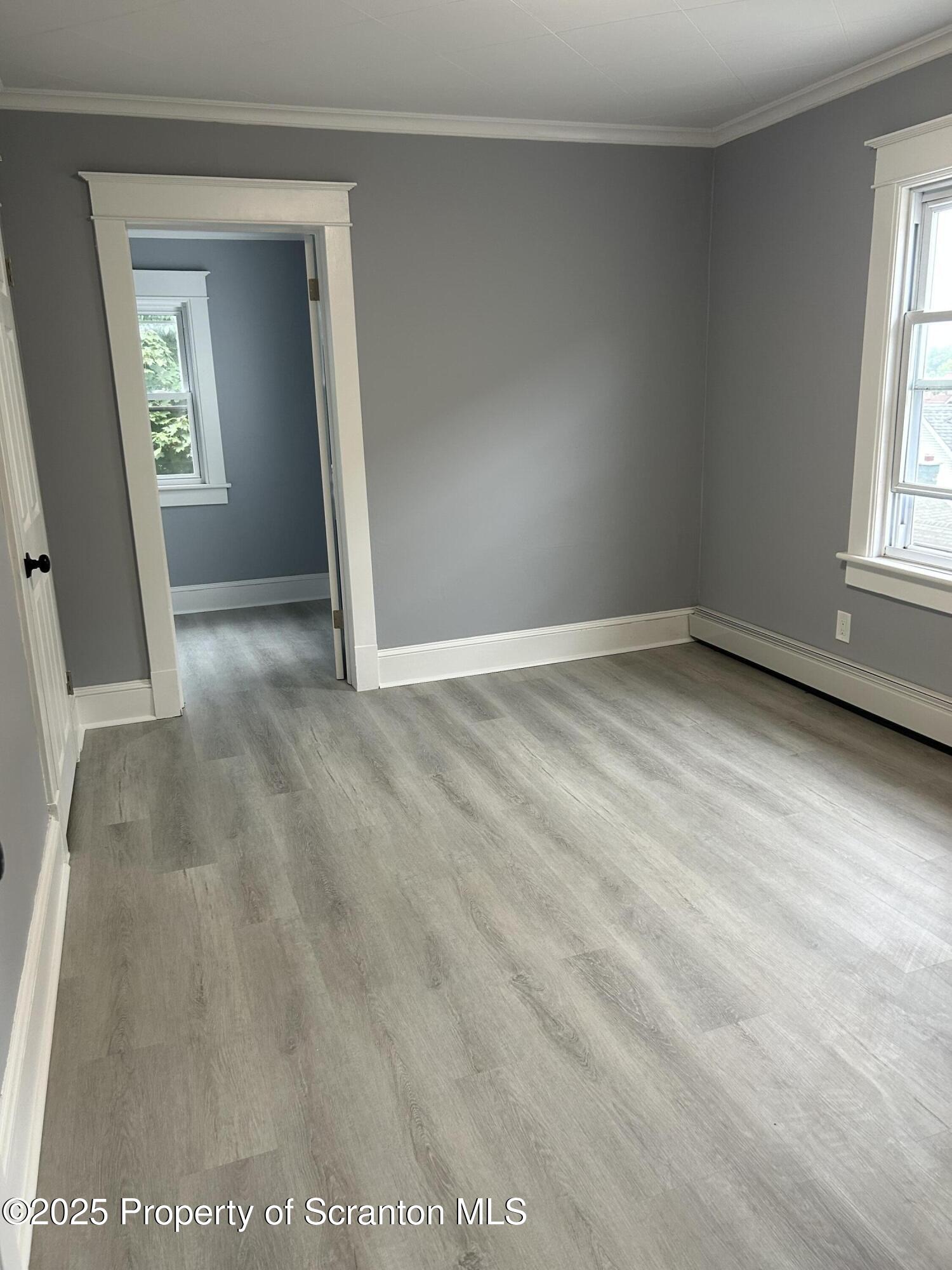 99 Washington Street Carbondale, PA 18407 - Photo 13 of 20 an empty room with windows