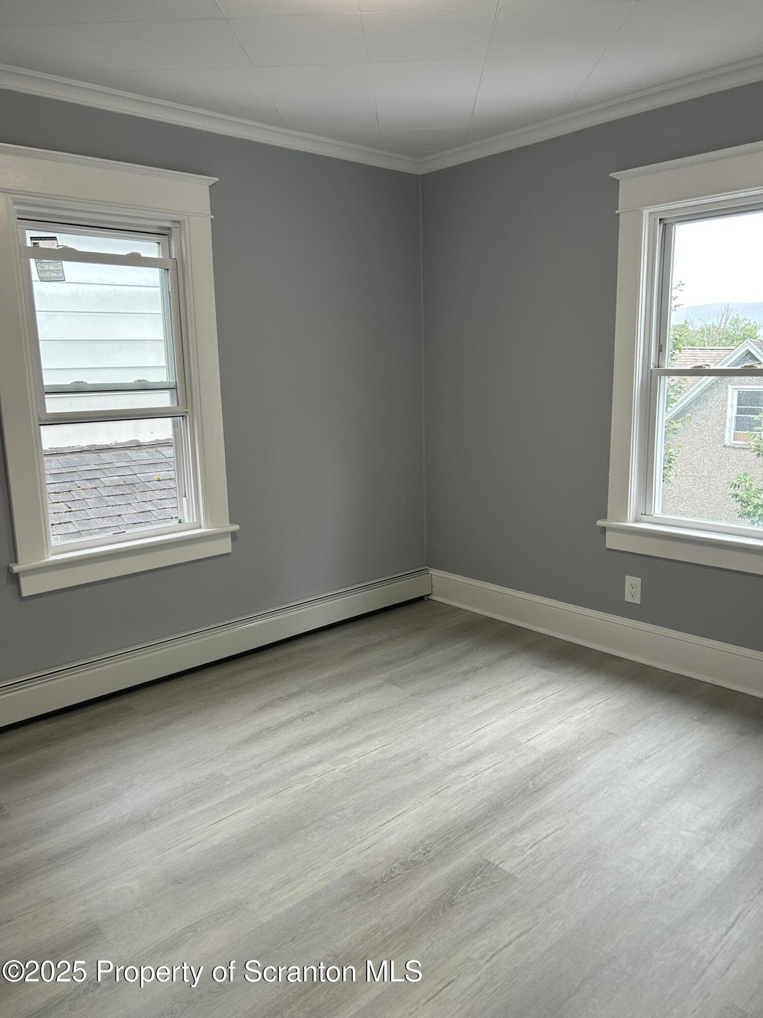 99 Washington Street Carbondale, PA 18407 - Photo 15 of 20 an empty room with a window