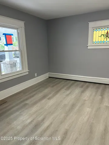 a bathroom with a sink toilet and window