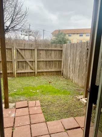 a view of a backyard of the house