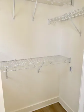 a view of a room with racks on the wall