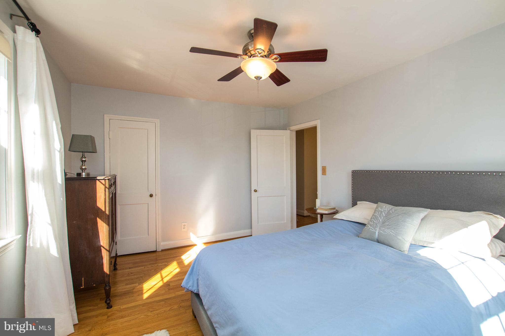 128 Overbrook Road Baltimore, MD 21212 - Photo 12 of 29 a bedroom with a bed and a flat screen tv