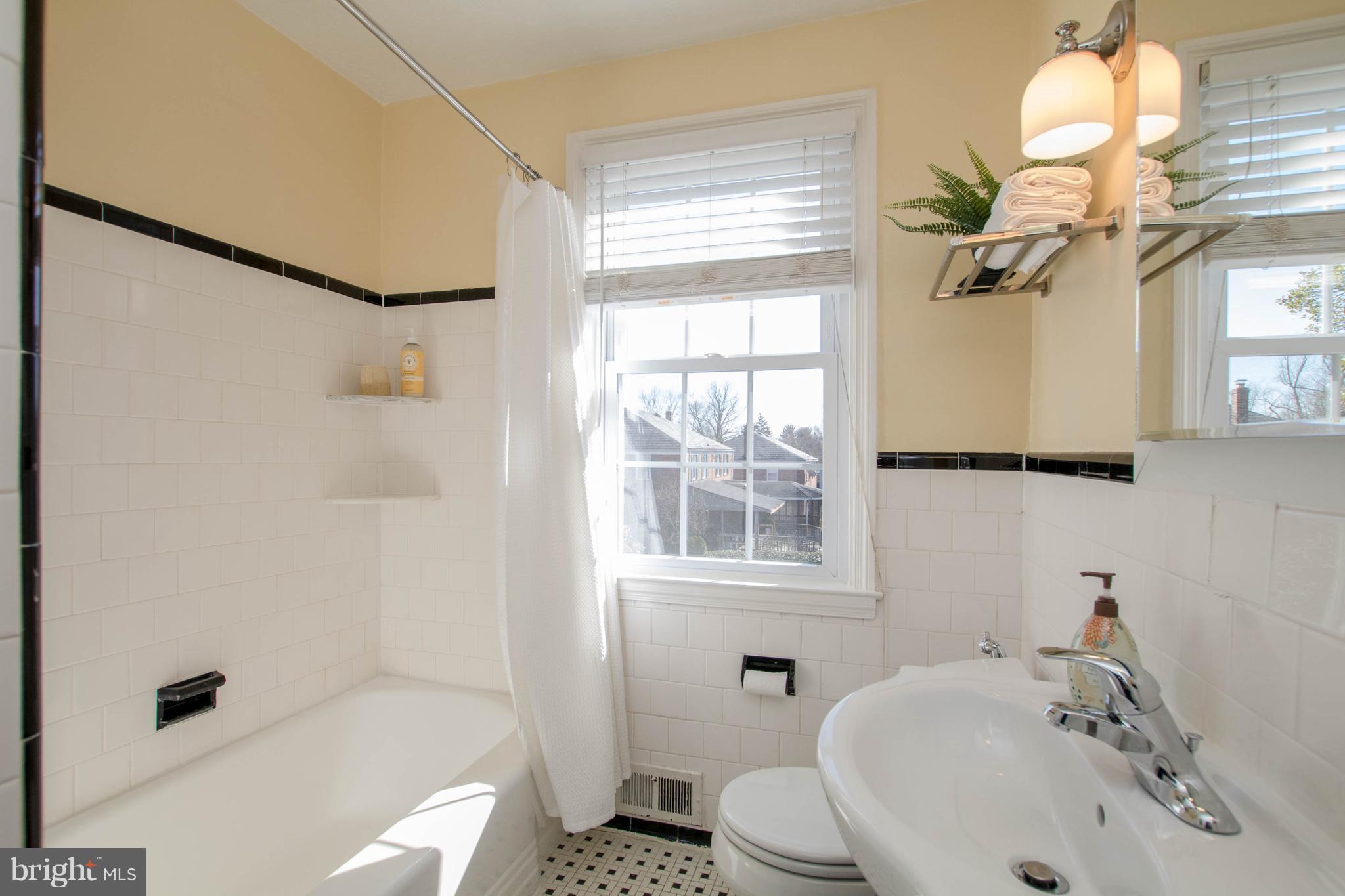 128 Overbrook Road Baltimore, MD 21212 - Photo 13 of 29 a bathroom with a sink a toilet and shower