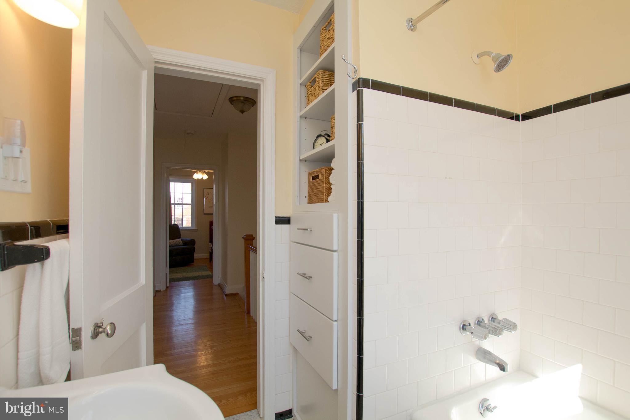 128 Overbrook Road Baltimore, MD 21212 - Photo 14 of 29 a bathroom with a shower and a sink
