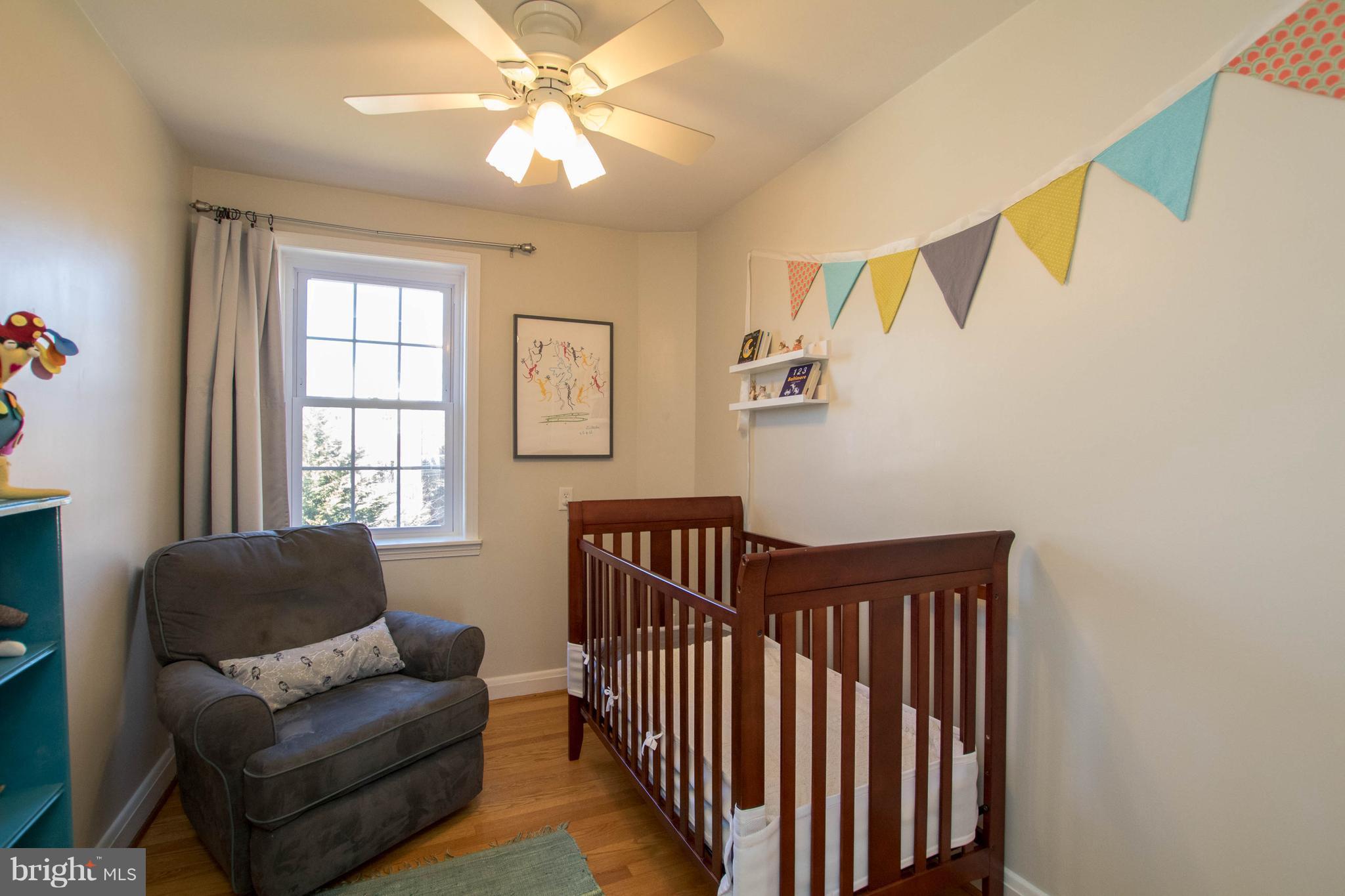 128 Overbrook Road Baltimore, MD 21212 - Photo 17 of 29 a bedroom with furniture and a window