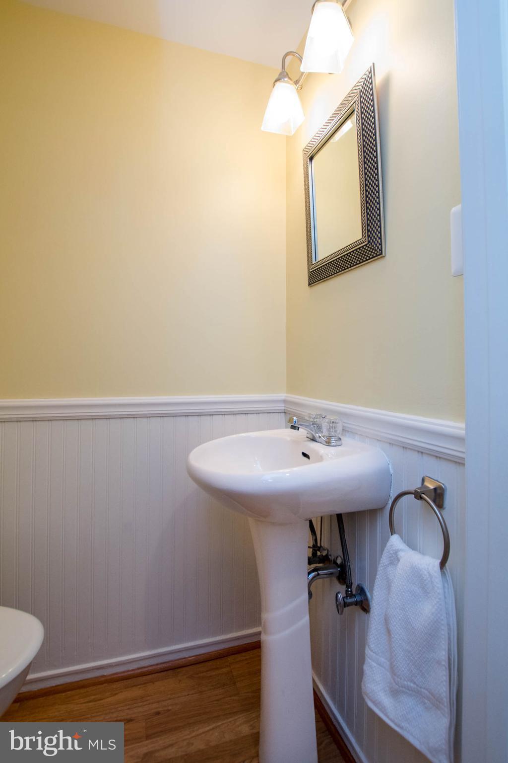 128 Overbrook Road Baltimore, MD 21212 - Photo 23 of 29 a bathroom with a sink a toilet and mirror
