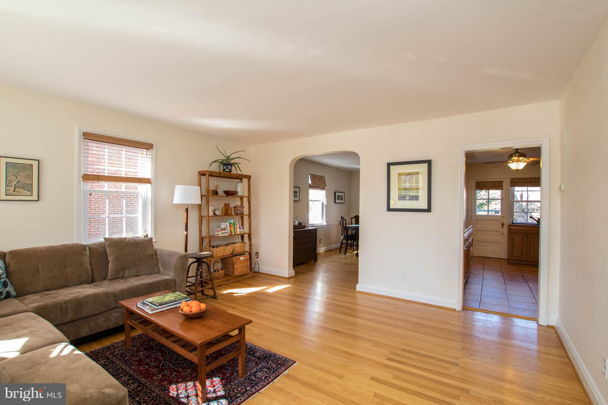 128 Overbrook Road Baltimore, MD 21212 - Photo 4 of 29 a living room with furniture a wooden floor and a window