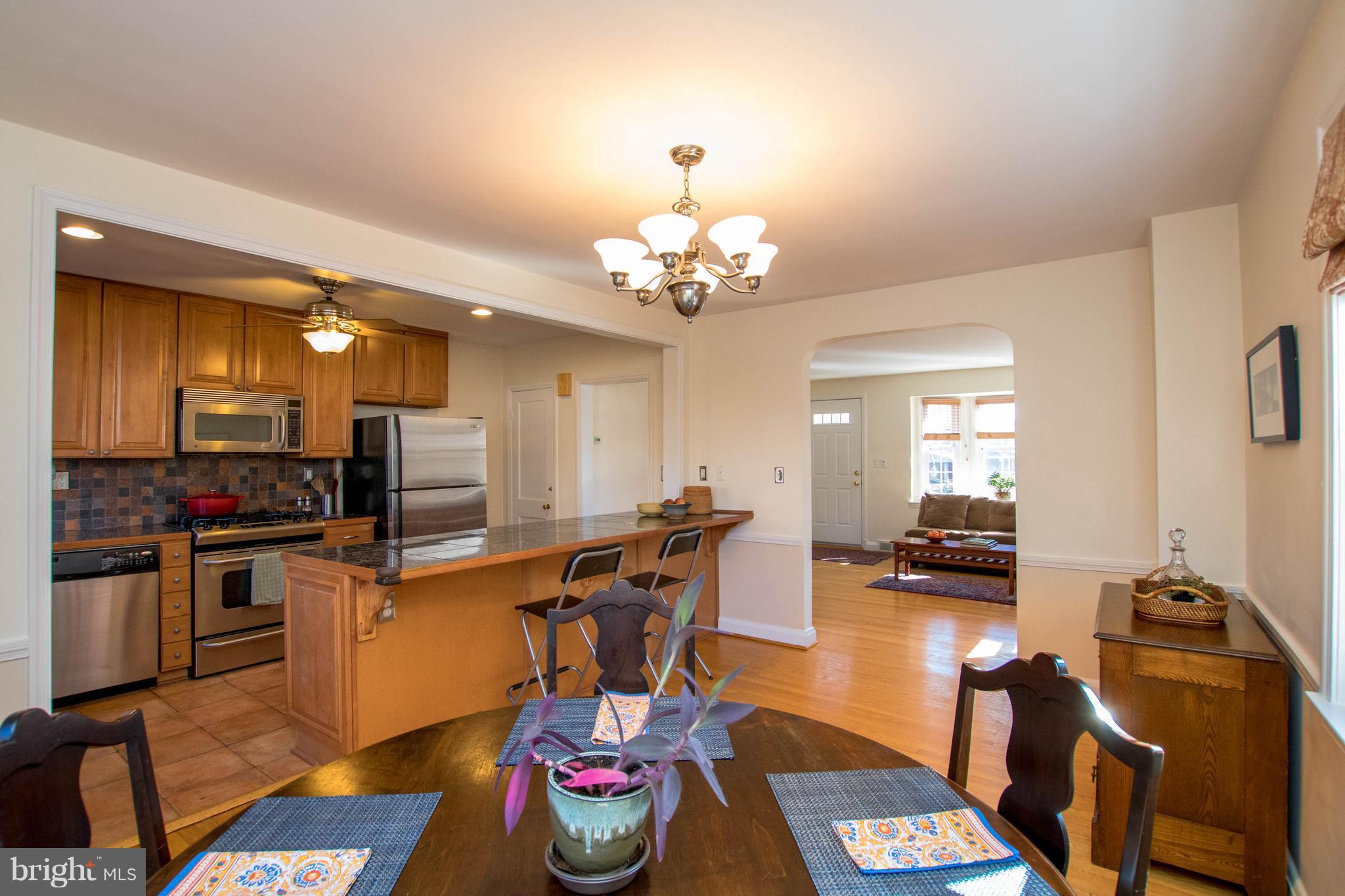 128 Overbrook Road Baltimore, MD 21212 - Photo 29 of 29 a view of a dining room with furniture and a chandelier