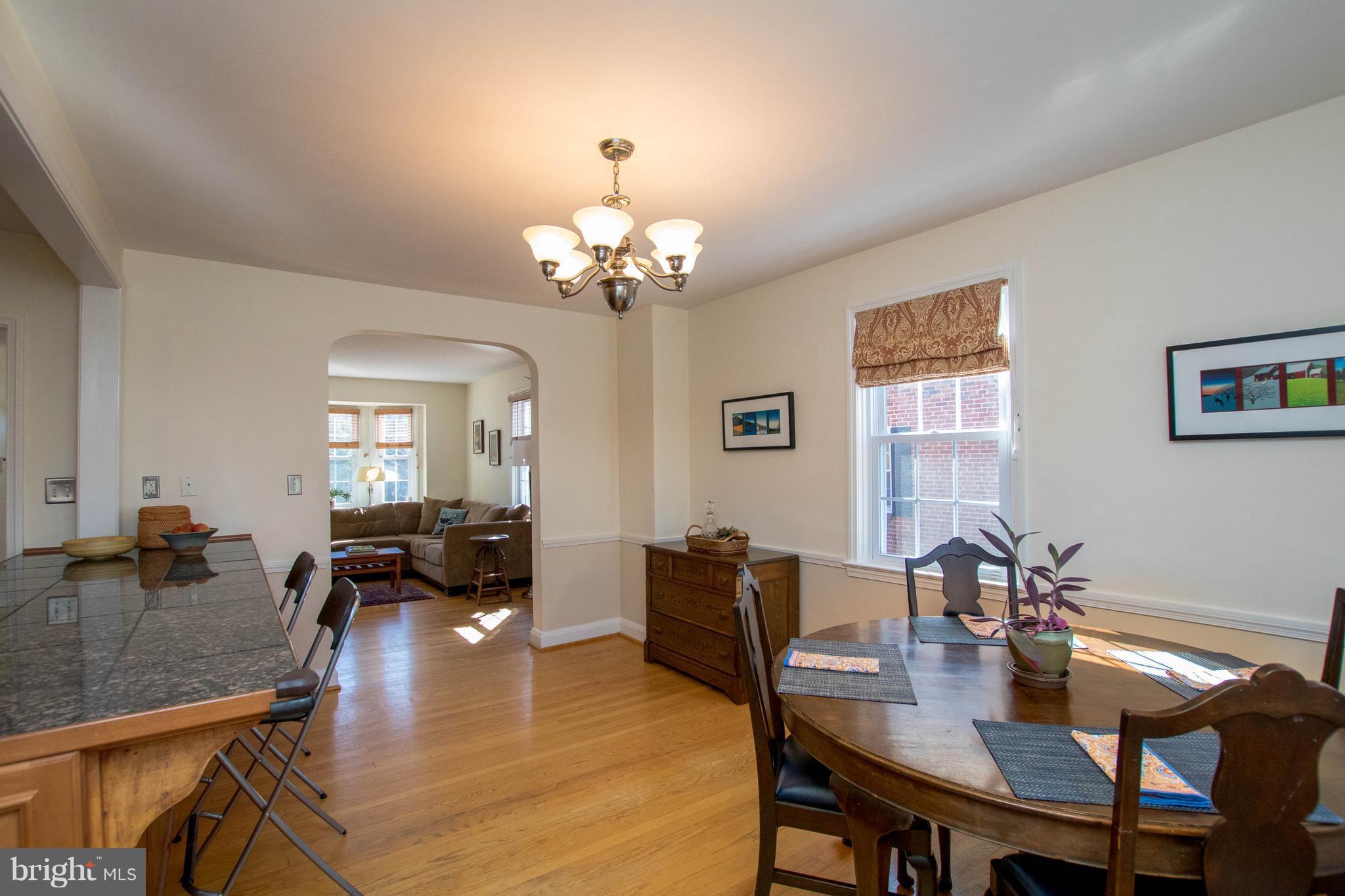 128 Overbrook Road Baltimore, MD 21212 - Photo 9 of 29 a view of a dining room with furniture and wooden floor