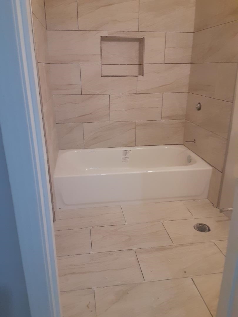 3349 Alta Road Memphis, TN 38109 - Photo 5 of 5 a bathroom with a bathtub