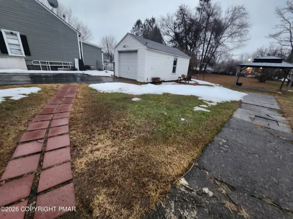 a view of a backyard of the house