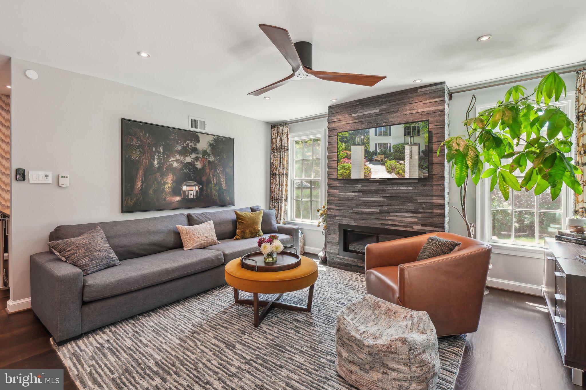 3626 Brandywine Street Northwest Washington, DC 20008 - Photo 11 of 42 a living room with furniture a fireplace and a potted plant