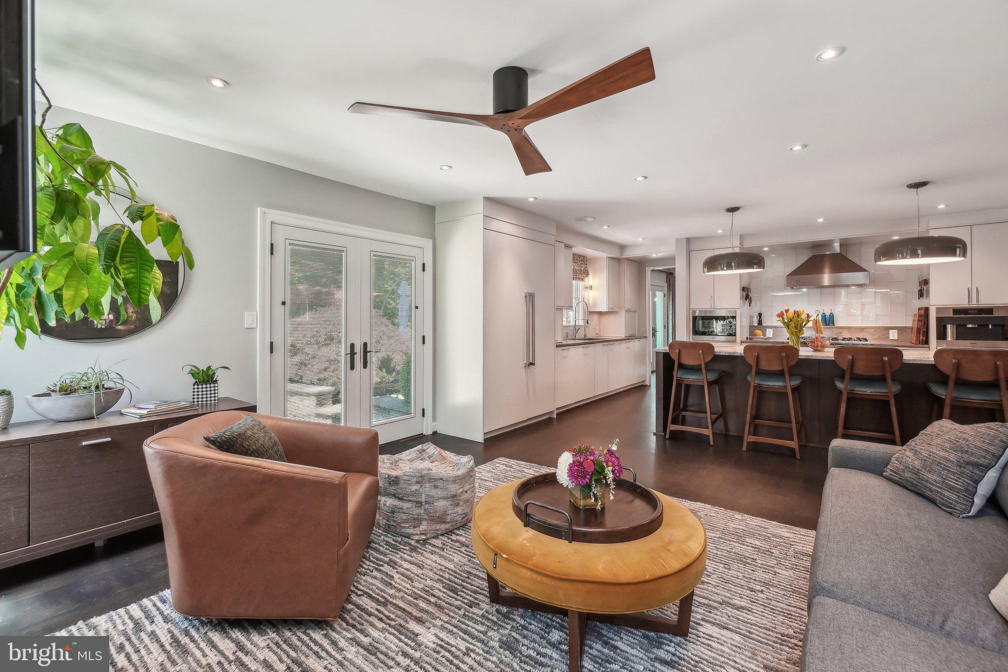 3626 Brandywine Street Northwest Washington, DC 20008 - Photo 12 of 42 a living room with kitchen and a couch